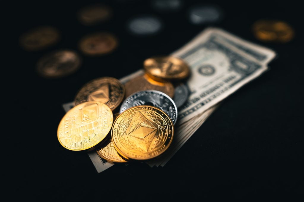 Four Assorted Cryptocurrency Coins · Free Stock Photo